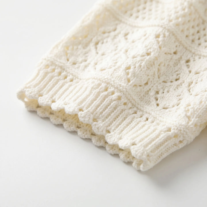 Textured crochet short-sleeve white blouse for women, featuring a stylish turn-down collar, a casual summer top.