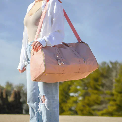 Compact 2-in-1 women's travel duffel bag, perfect weekend getaway carry-on luggage made with vegan leather.