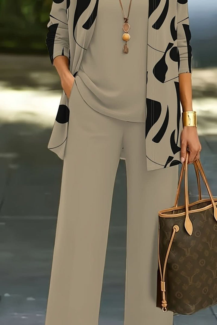 Stylish women's abstract print three-piece matching set, perfect for a coordinated contemporary outfit.
