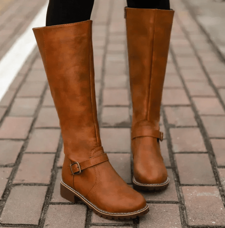 Interior view of women's boots, highlighting comfort footbed & gel insole for superior foot support.