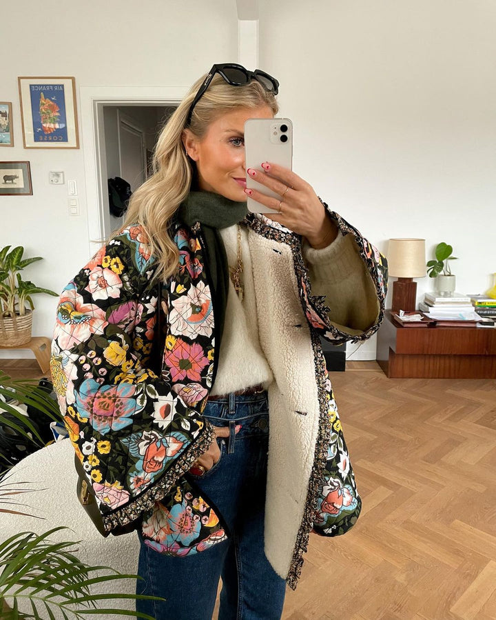 Stylish women's Aurora floral print padded jacket. Warm & trendy winter coat with a retro fashion vibe.
