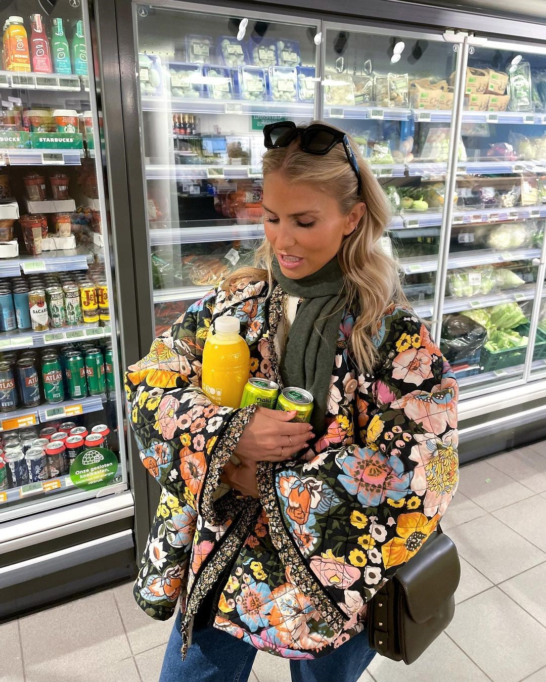 Women's Aurora padded jacket featuring a vibrant floral print. Cozy, windproof & oversized fit outerwear.