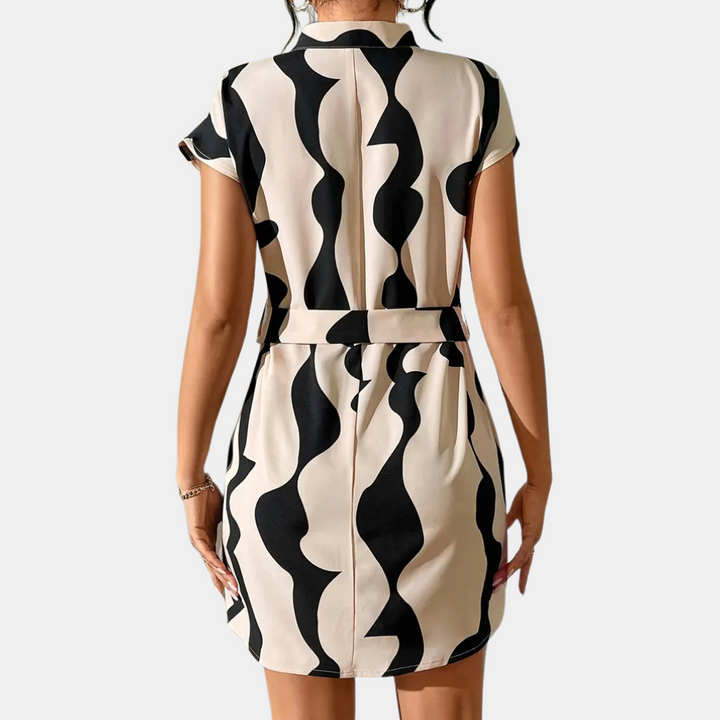 Trendy beige mini dress for women with a flattering belt. Elegant and chic, ideal for casual or party wear.