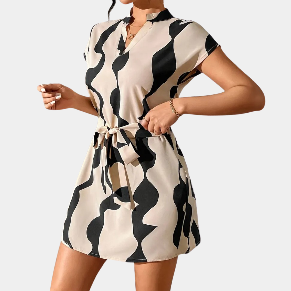 Chic and comfortable beige belted dress for women. Trendy mini style, perfect for elegant spring/summer fashion looks.