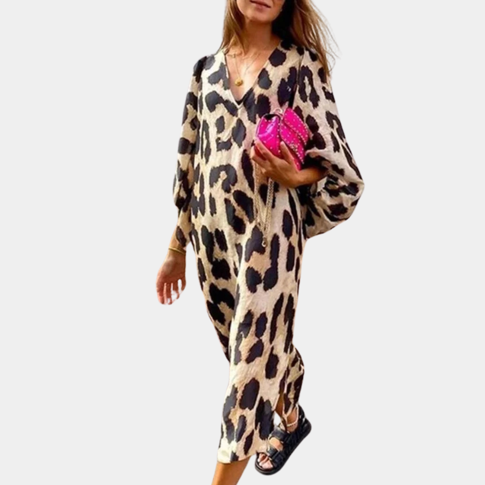 Stylish women's beige loose-fit midi dress with bold panther print, perfect for versatile fashion.