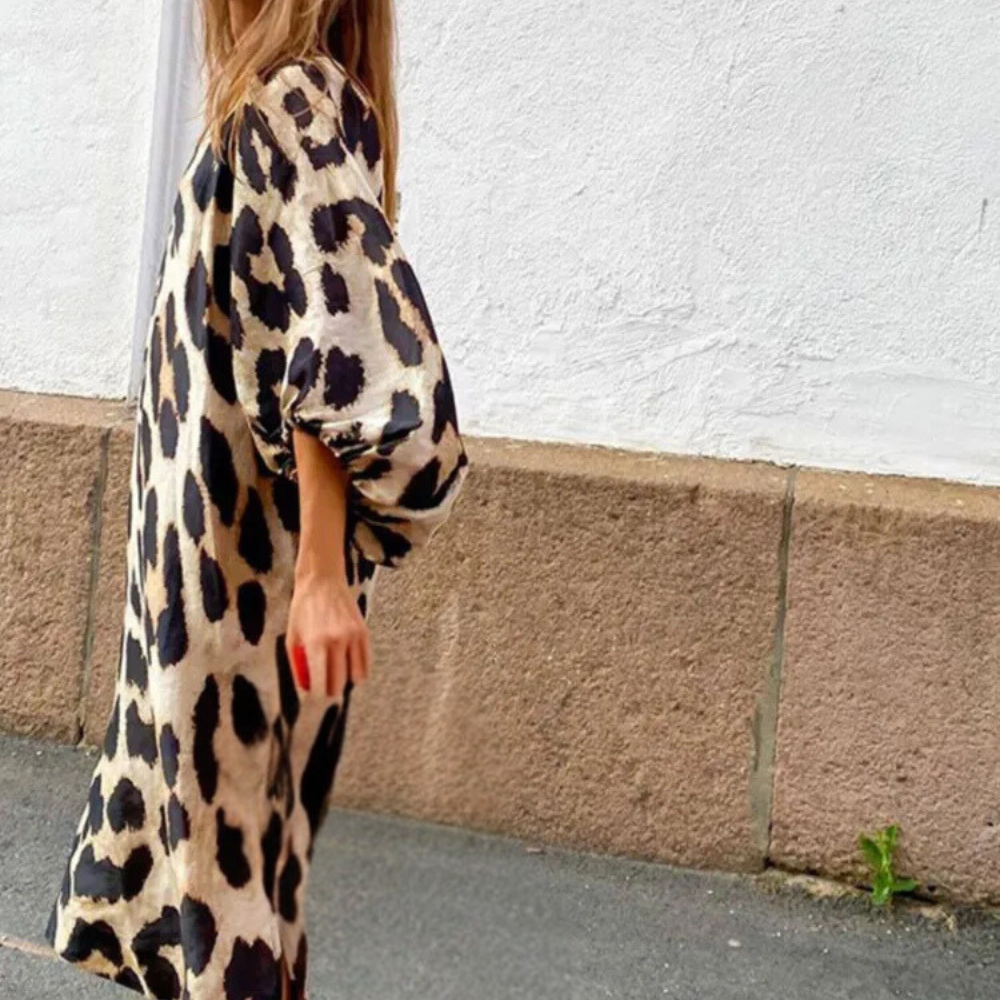 Elegant women's beige midi dress featuring a chic panther animal print and a comfortable loose fit.