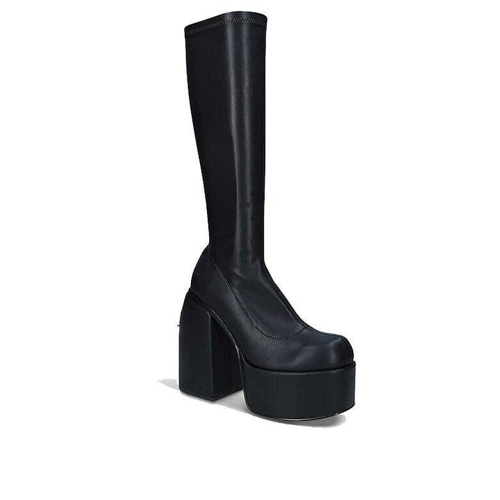 Chic women's black leather heeled boots, offering an elevated style for various dressy & casual occasions.