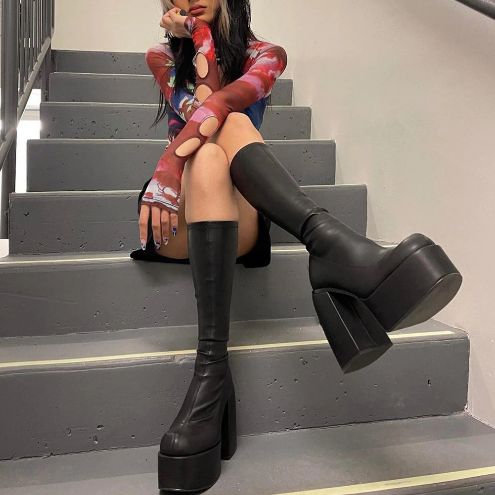Elegant black heeled boots for women, enhancing any wardrobe with a touch of chic versatility & comfort.