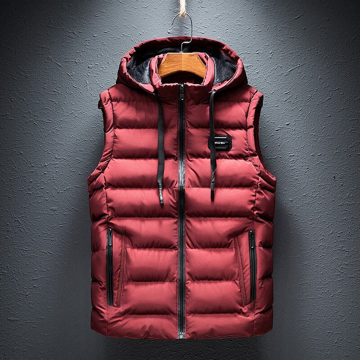 Warm women's red hooded padded vest, an essential autumn fashion layering piece for outdoor comfort.