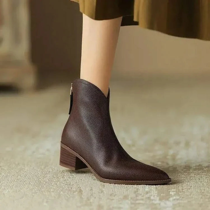 Stylish women's black pointed toe ankle boots with low heel, perfect for fall fashion and everyday wear.