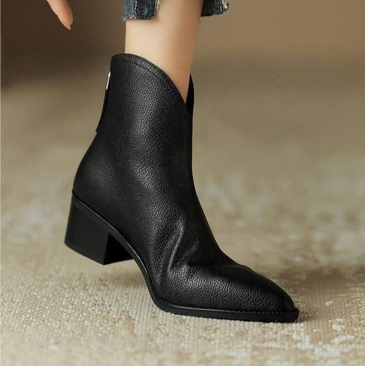 Smooth finish women's black pointed toe ankle boots, a classy choice for fall & winter wardrobes.