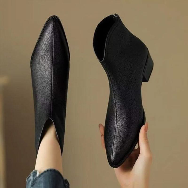 Women's sophisticated black pointed toe ankle boots, a must-have for chic fall & winter fashion outfits.