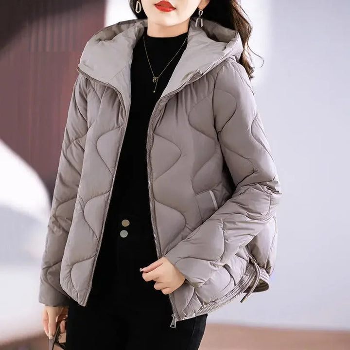 Front view of a warm women's puffer jacket with diamond quilting, perfect fall & winter outerwear.