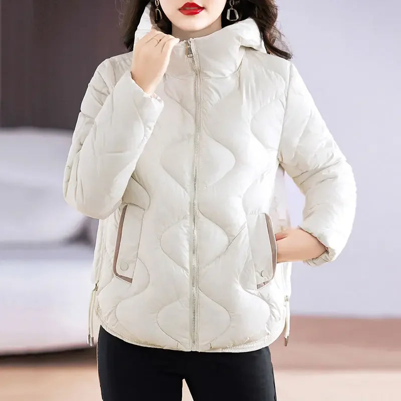 Full-length shot of a women's stylish, insulated puffer jacket, featuring a modern, versatile design.
