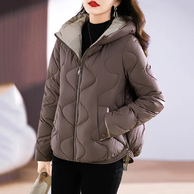 Casual women's hooded puffer jacket, providing exceptional warmth & protection against winter elements.