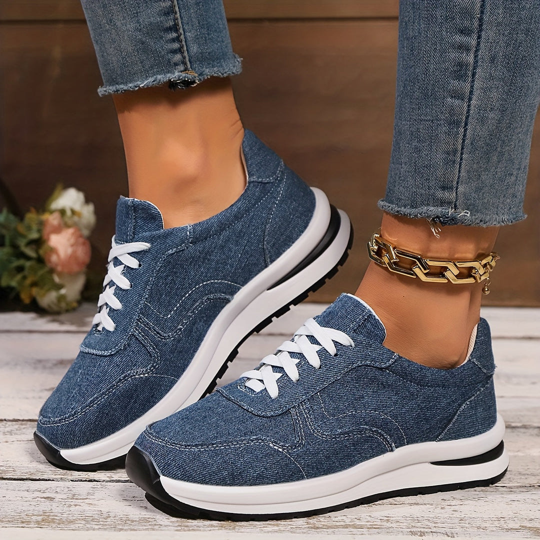 Stylish women's blue sneakers with ergonomic design, all-day comfort, and supportive arch for walking.
