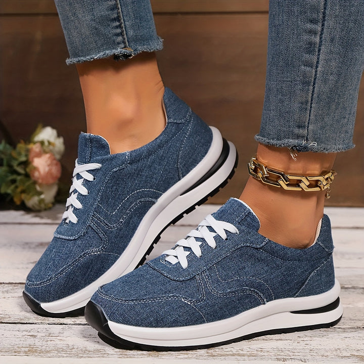 Stylish women's blue sneakers with ergonomic design, all-day comfort, and supportive arch for walking.