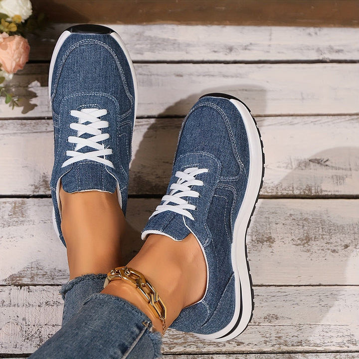 Women's supportive blue walking sneakers featuring a wide toe box and arch support for ergonomic comfort.