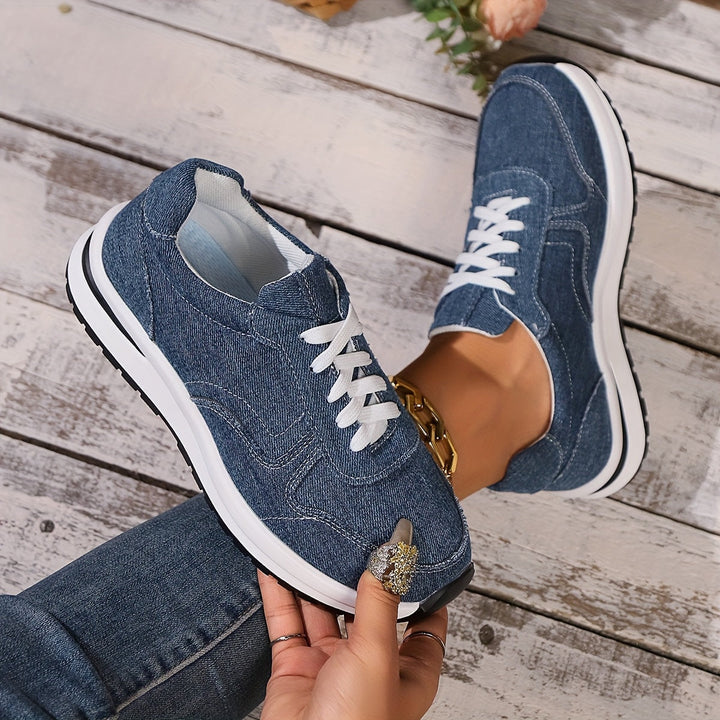 Ergonomic women's blue sneakers offering superior arch support, wide toe box, and comfort for long walks.