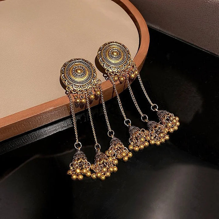 Pair of Noura boho ethno pendant earrings for women. Unique, stylish bohemian jewelry.
