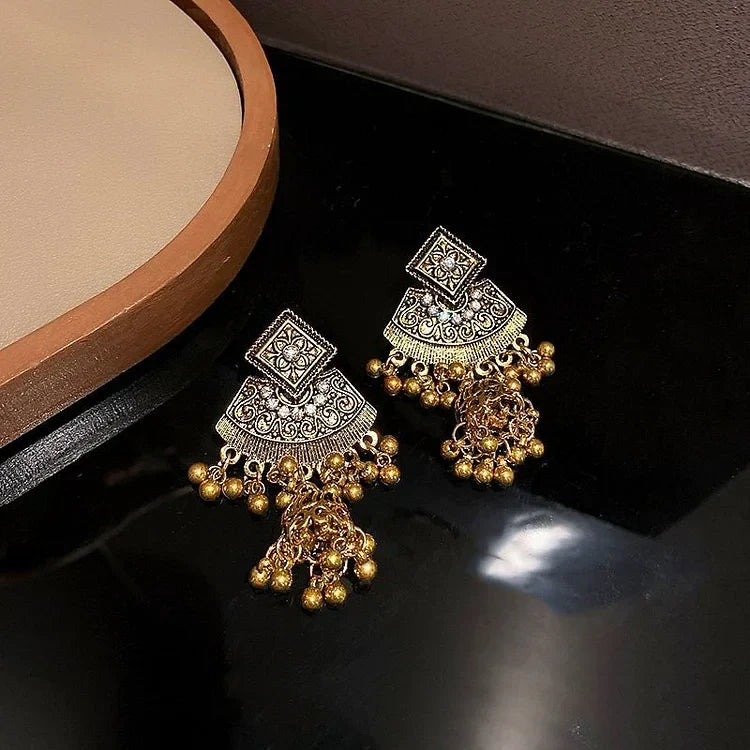 Vibrant women's boho pendant earrings. Ethnic bohemian jewelry accessory for a unique look.