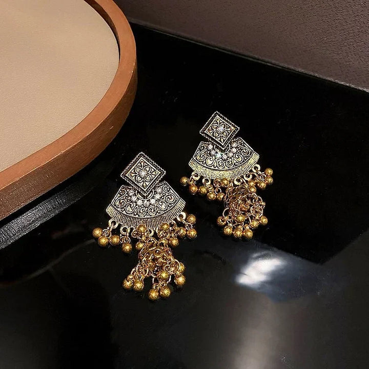 Vibrant women's boho pendant earrings. Ethnic bohemian jewelry accessory for a unique look.