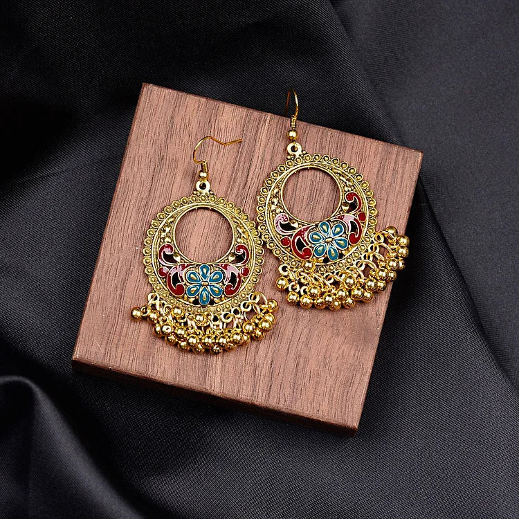 Handcrafted women's bohemian ethno pendant earrings. Unique and stylish jewelry accessory.