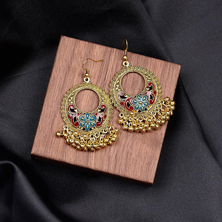 Handcrafted women's bohemian ethno pendant earrings. Unique and stylish jewelry accessory.