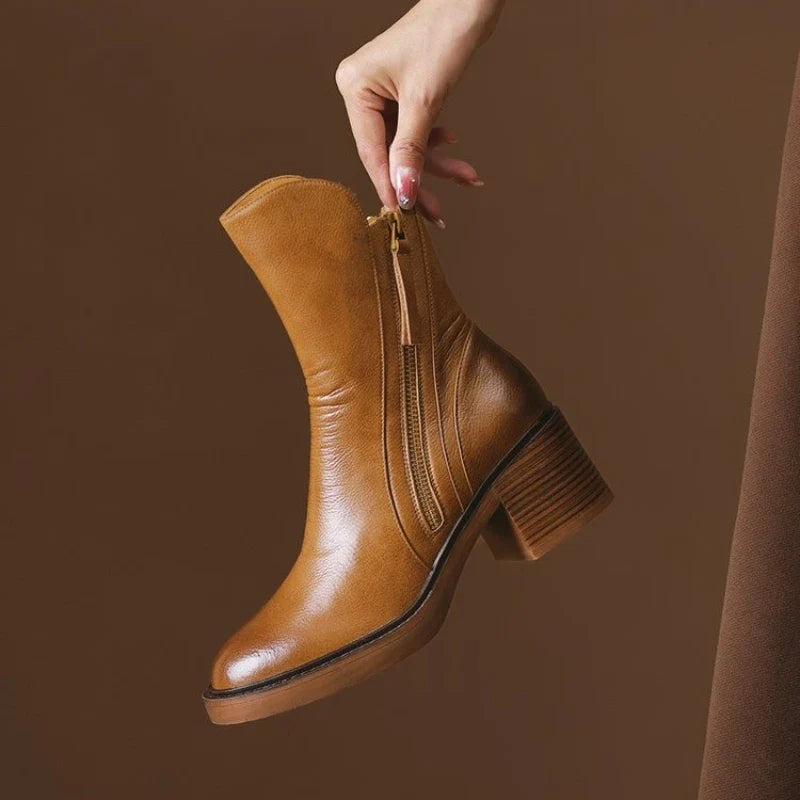 Comfortable black high-heel ankle boots for women, ideal for sophisticated winter fashion and fall outfits.