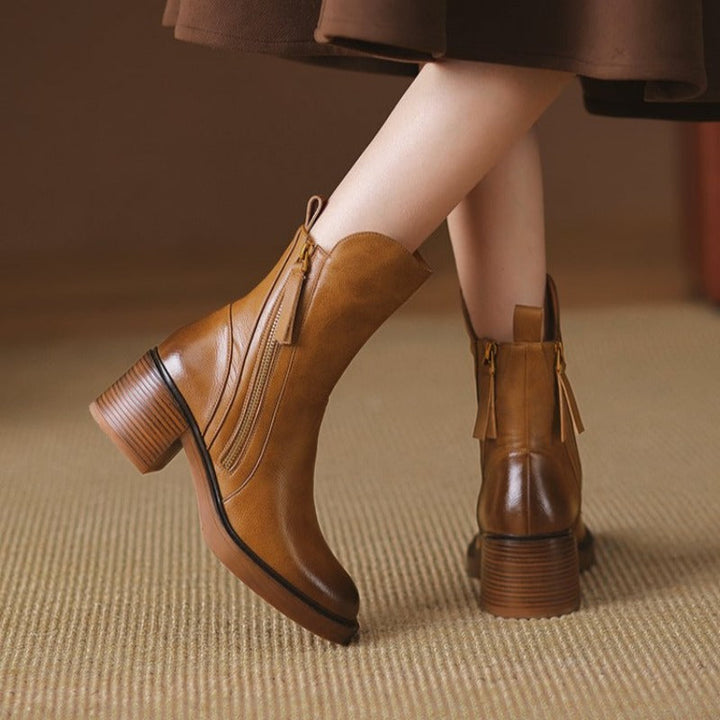 Fashionable women's ankle boots with a high heel, offering a stylish look for any winter or fall ensemble.