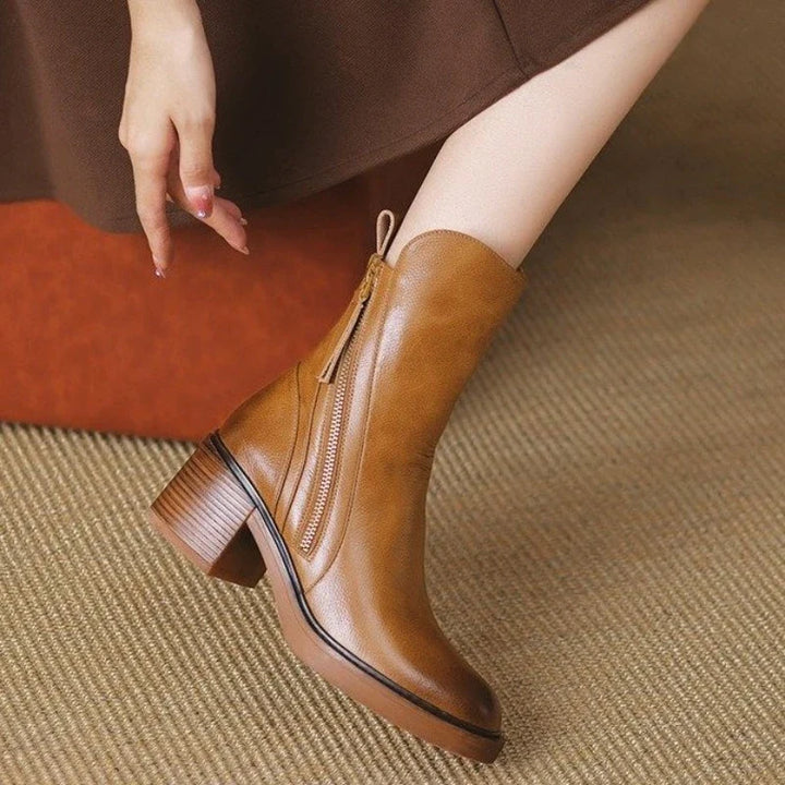 Versatile women's high-heel ankle boots, essential fashion footwear for fall & winter elegant styles in black.