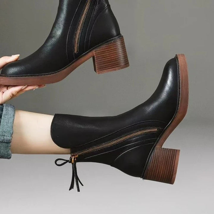 Women's brown & black high-heel ankle boots, a stylish and comfortable choice for elegant fall & winter fashion.