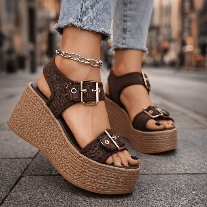 Stylish women's buckle wedge sandals for elevated comfort, perfect summer shoes.