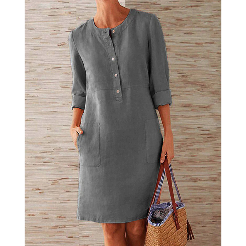 Everyday women's dress: stylish, comfortable, with a round neck, long sleeves, and useful pockets. Knee-length design.