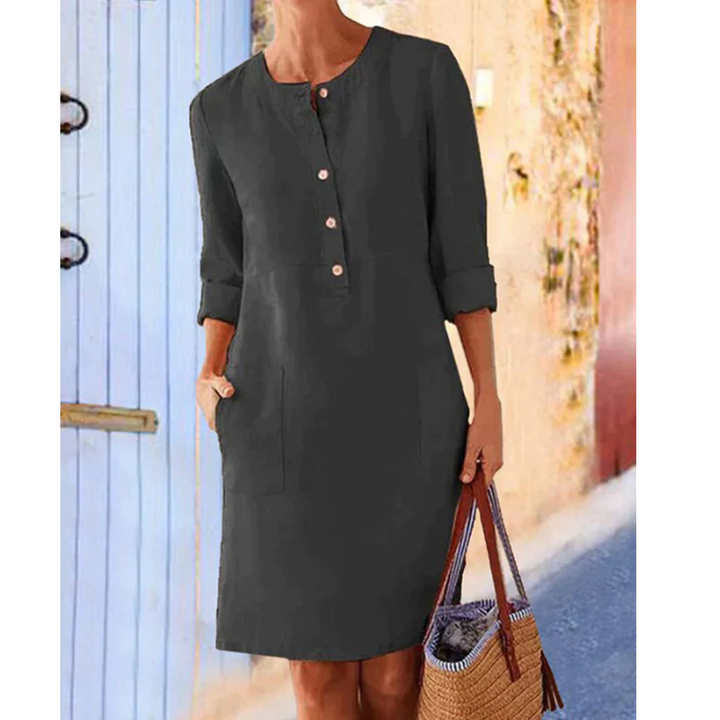 Stylish women's casual dress. Round neck, long sleeves, knee-length, and practical pockets. Comfortable summer fashion.