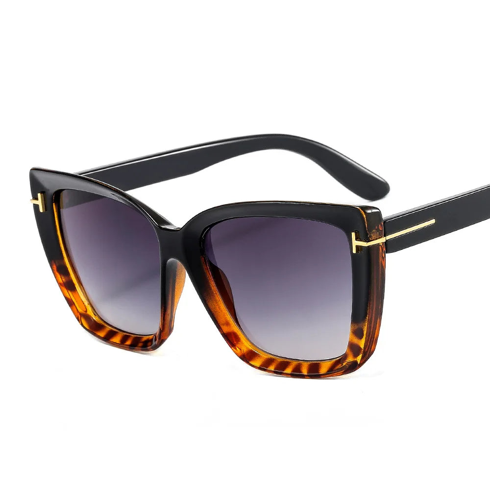 Detailed view of women's cat-eye sunglasses, gradient UV400 lenses, essential summer fashion eyewear