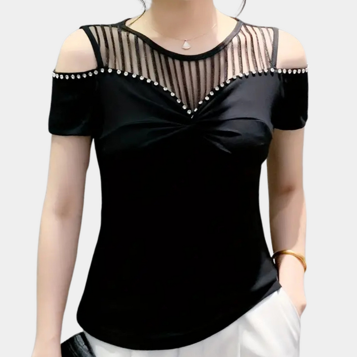 Stylish women's cold-shoulder top for trendy comfort. Perfect for casual or dressy looks.