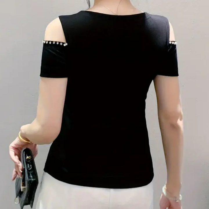 Women's fashionable cold-shoulder top in black. Soft fabric, elegant for everyday style.