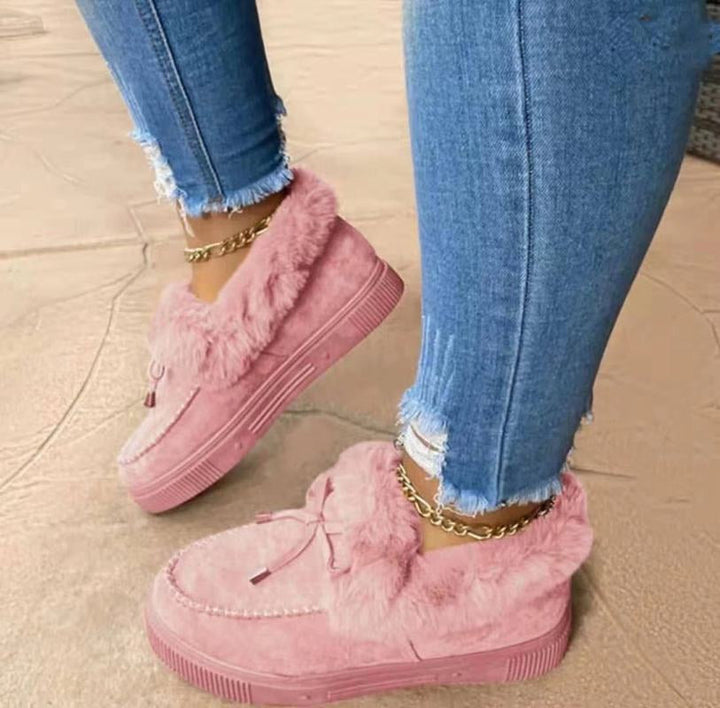 Woman wearing stylish warm winter boots, perfect for daily comfort in cold weather & winter fashion.