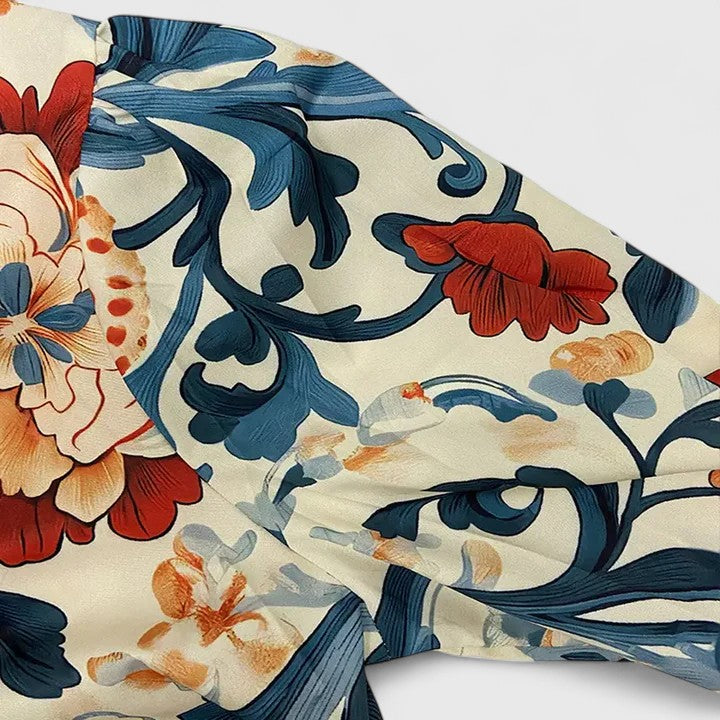 Elegant dark blue women's floral blouse featuring 3D flowers. Versatile long sleeve top for ladies.