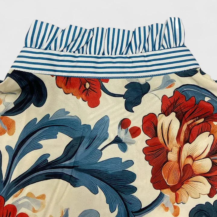 Comfortable and stylish women's dark blue floral long sleeve blouse, ideal for elegant occasion wear.