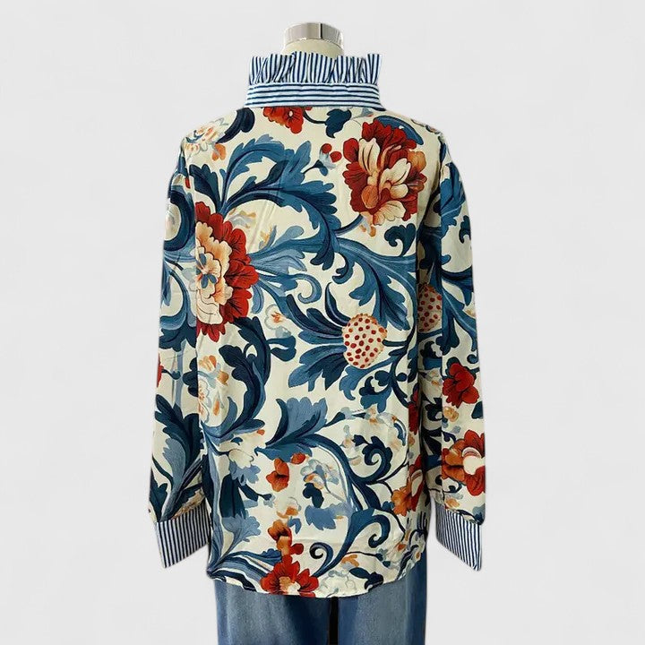 Fashionable women's dark blue floral blouse. Stylish long sleeve ladies top, versatile for any outfit.