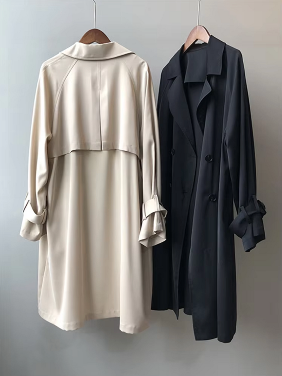 Close-up of the elegant lapel and buttons on a women's double-breasted waterproof trench coat, ideal for office style.