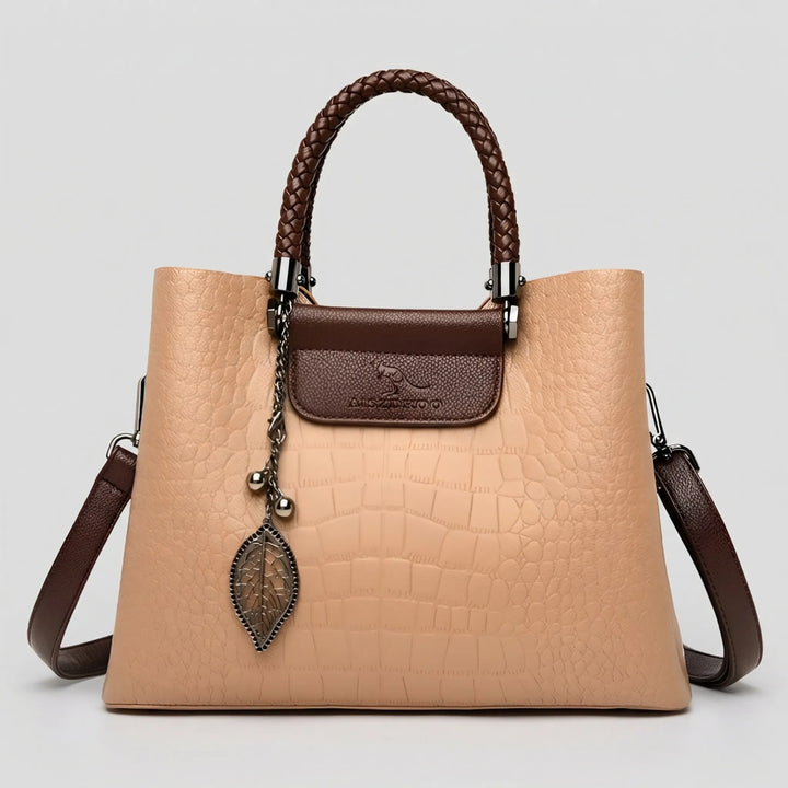 Fashionable beige women's tote bag, embossed texture & braided handle. A chic and versatile accessory.