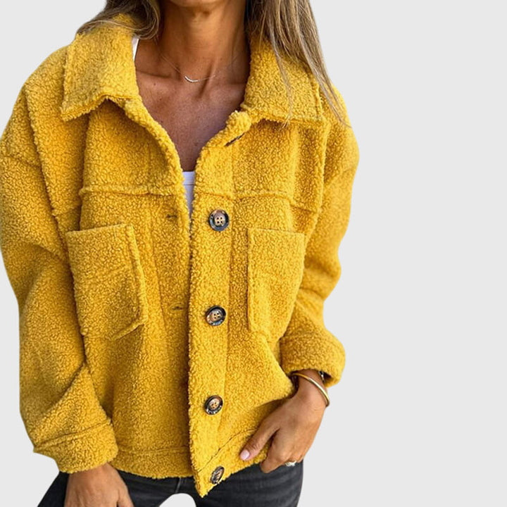 Chic women's fall outerwear, a fashionable jacket with practical pockets, perfect for seasonal versatility.