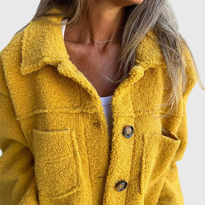 Women's elegant fall coat, a stylish outerwear piece with a sophisticated cut, perfect for everyday wear.