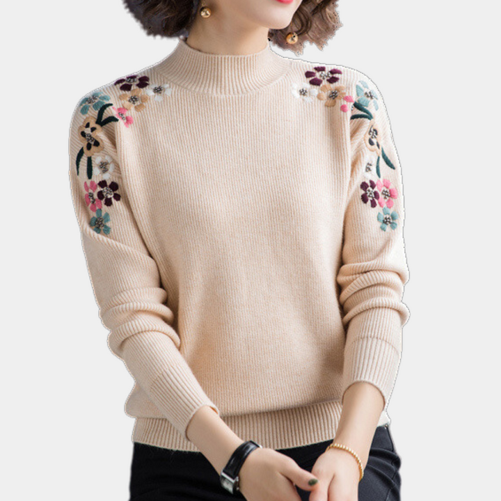 Elegant floral print women's crew neck sweater. Loose fit, perfect for comfortable, stylish casual wear.