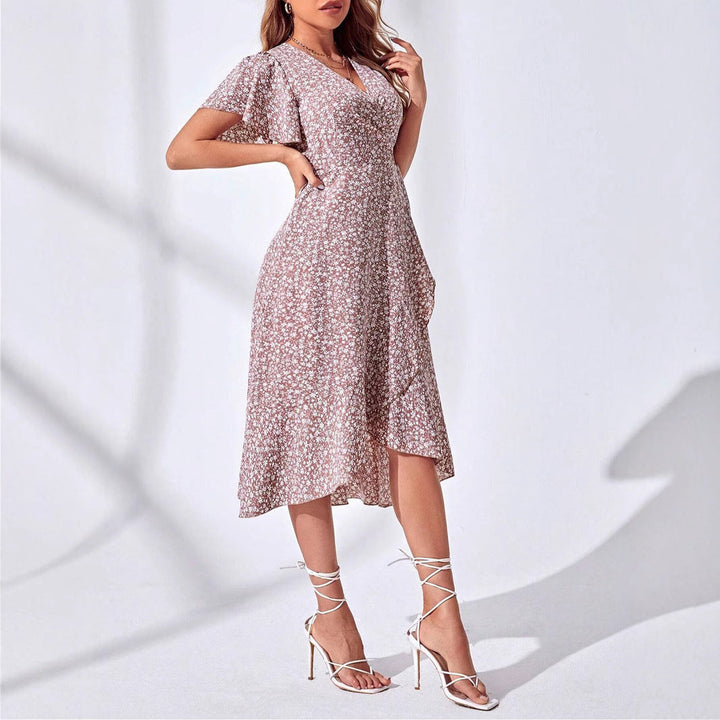 Women's knee-length floral wrap dress with a chic ruffled V-neck. A stylish and lightweight summer dress for any occasion.