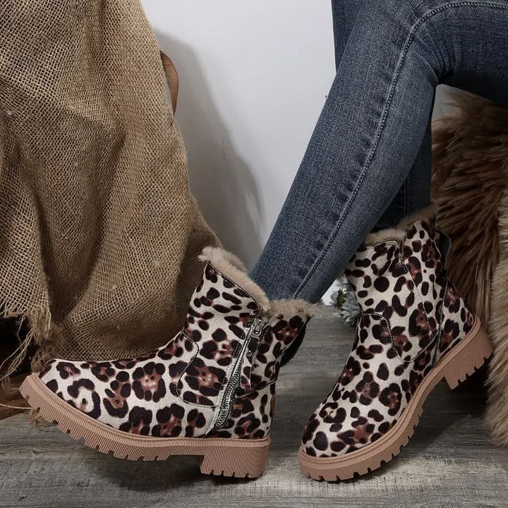 Elegant women's winter boots with luxurious fur lining and a sturdy construction for durability.