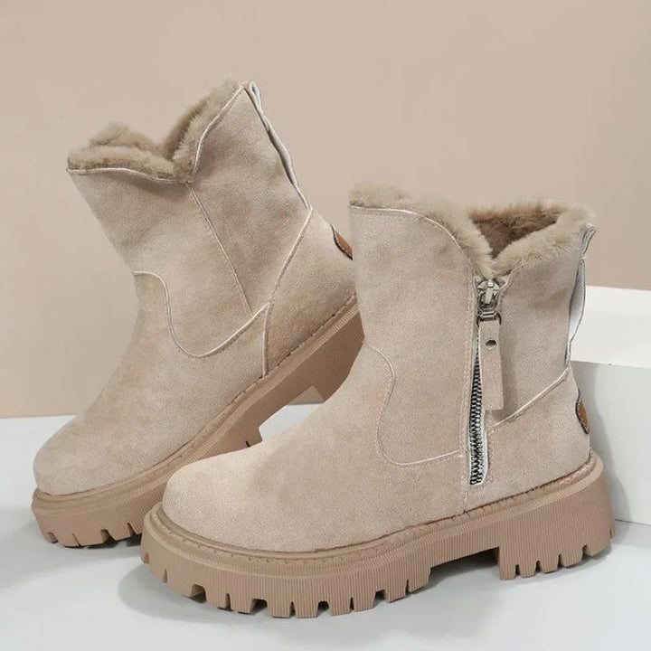 Detail of the plush fur lining inside women's winter ankle boots, ensuring warmth.